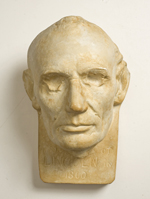 Plaster mask of face of Lincoln with hollowed-out eyes and inscribed 